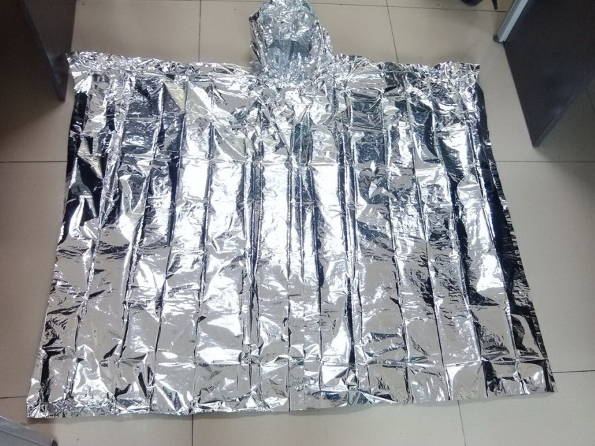 Emergency disposable silver foil poncho 